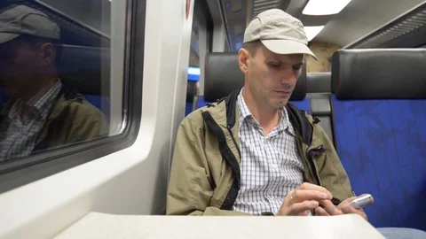 Man with smartphone in a train Video stock 83492243