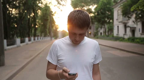 Man with smartphone walking. Slow motion Stock Footage 39477108