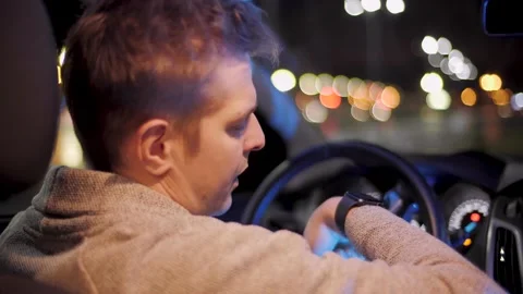 Man with smartwatch in a car using voice recorder recognition audio message Stock Footage 144322110