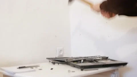 The man smashed laptop with hammer Stock Footage 163816101