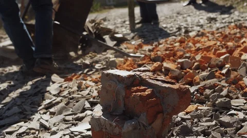 A man smashes a sledgehammer on a stone Stock Footage 128596018