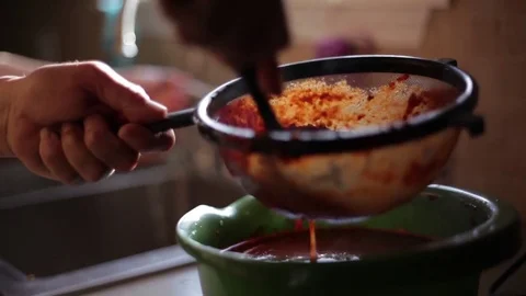 Man Smashing Peppers into Salsa Paste Video stock 76032521