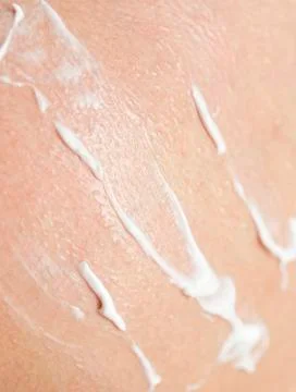 Man smears sunscreen Stock Photos