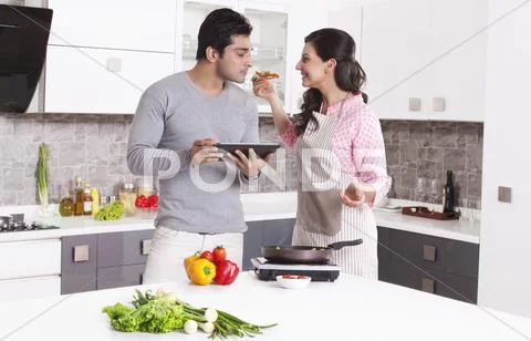 Man Smelling His Wifes Cooking