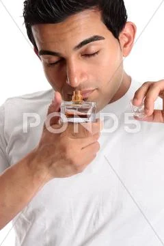 Man smelling perfume Stock Photos