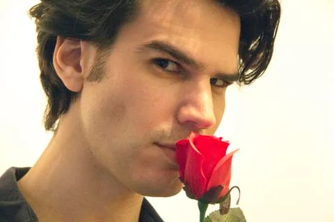 Man Smelling A Rose Stock Photos