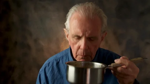Man smelling soup Stock Footage 108427136