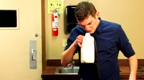 Man smells bad milk 스톡 동영상 44067535