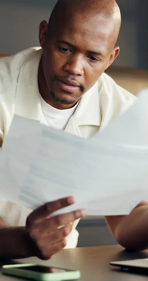 Man, smile and documents in home with laptop, financial planning or rebate for Stock Footage 336842698