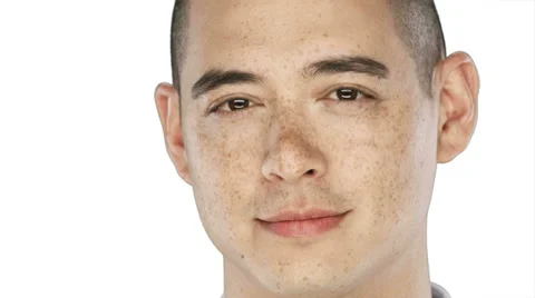 Man smiles and nods into the camera on a white background Stock Footage 33842068