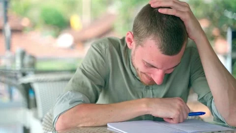 The man smiles nervously and laughs on the verge of a nervous breakdown. Video stock 231337145