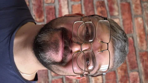 The man smiles. Three points on the face. Vertical video 4K Stock-Footage 150287199