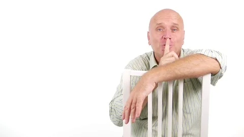 Man Smiling and Gesturing Asking Quiet Using Finger Hand Sign Noise Forbidden  Video stock 80517708