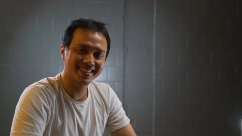 A man smiling at the camera. Video stock 105965132