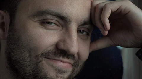 Man smiling to camera in some public transport. Stock Footage 115984160