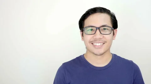 Man Smiling Close up Portrait on White Background in Studio Slow Motion Видео 59949569