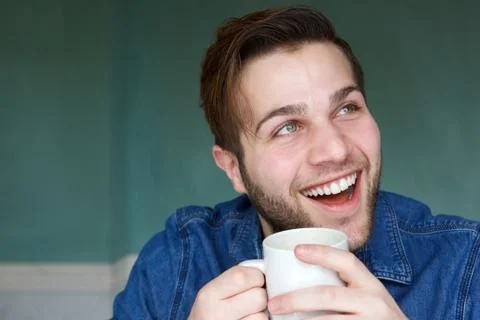Man smiling with cup of coffee Stock Photos