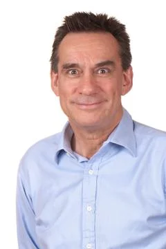 Man smiling with funny expression Stock Photos