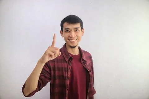 A man smiling happy with one hand showing one fingers sign Stock Photos