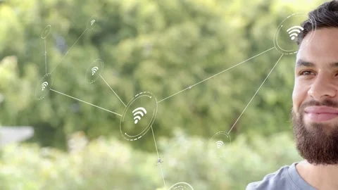 Man smiling as node appears, causing wifi nodes moving inward and overlapping Stock Footage 333169767