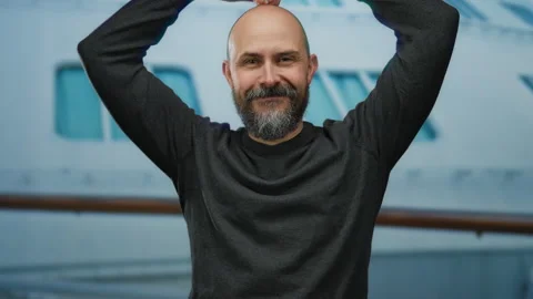 Man smiling outdoors on a cruise ship with a beard and a bald head, showcas.. Stock Footage 308564471
