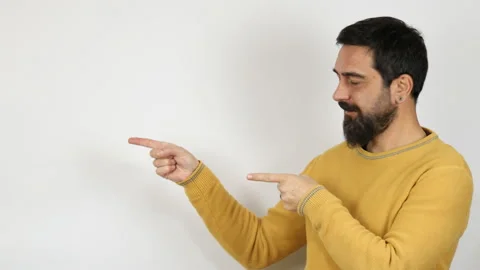 Man smiling pointing with two hands and fingers to the side. Stock Footage 165900717