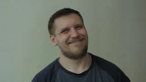 Man smiling, shaking head and giving up. Stock-Footage 77413404