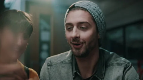 Man smiling while looking down at his present Video stock 132015346