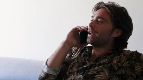 Man Smiling While Talking on the Phone, Side View Stock Footage 295143719
