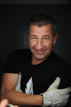 Man smiling while working Stock Photos