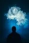 The man smoke an electric cigarette on the background of a blue light Photo