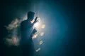 The man smoke an electric cigarette with a ring against the background of t.. Photo