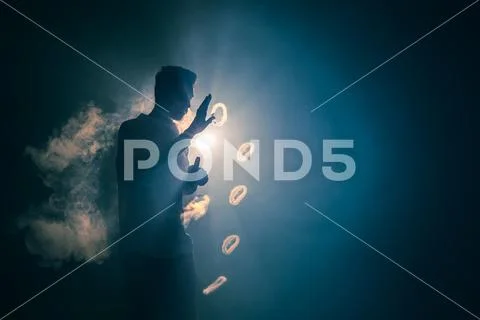 The man smoke an electric cigarette with a ring against the background of t.. Stock Photos
