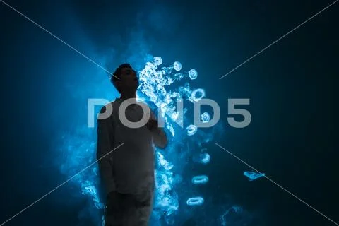 The man smoke an electric cigarette with a ring against the background of t.. Stock Photos