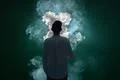 The man smoke an electrical cigarette and on the black background Photo
