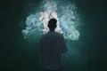 The man smoke an electrical cigarette and on the dark background Photo