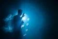 The man smoke an electrical cigarette with a ring against the background of.. Photo
