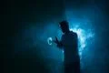 The man smoke an electrical cigarette with a ring on the dark background Photo