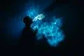 The man smoke an electronic cigarette on the background of the blue light Photo