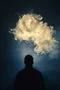 The man smoke an electronic cigarette on the background of bright light Photo