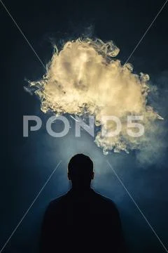 The man smoke an electronic cigarette on the background of bright light Stock Photos
