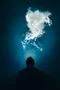 The man smoke an electronic cigarette on the background of a bright light Photo