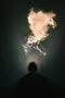 The man smoke an electronic cigarette on the bright light background Photo