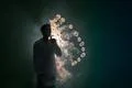 The man smoke an electronic cigarette with a ring against the background of.. Photo