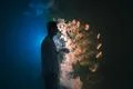 The man smoke electronic cigarette with a ring on the blue background Photo