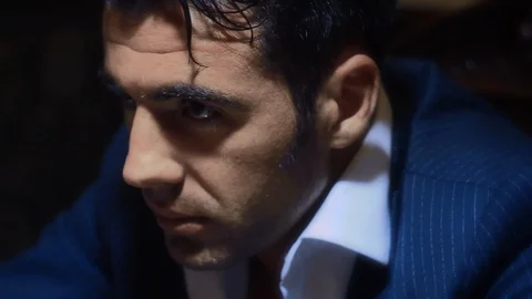 A man smokes a cigar at the table Stock Footage 87096203