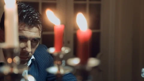 A man smokes a cigar at the table Stock Footage 87333260