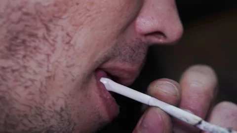 Man smokes a cigarette close up Stock Footage 102236953