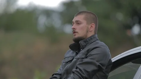 Man smokes a cigarette in a depression Stock Footage 71603515