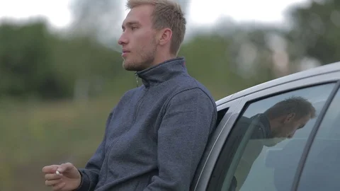 Man smokes a cigarette in a depression Stock-Footage 71604749